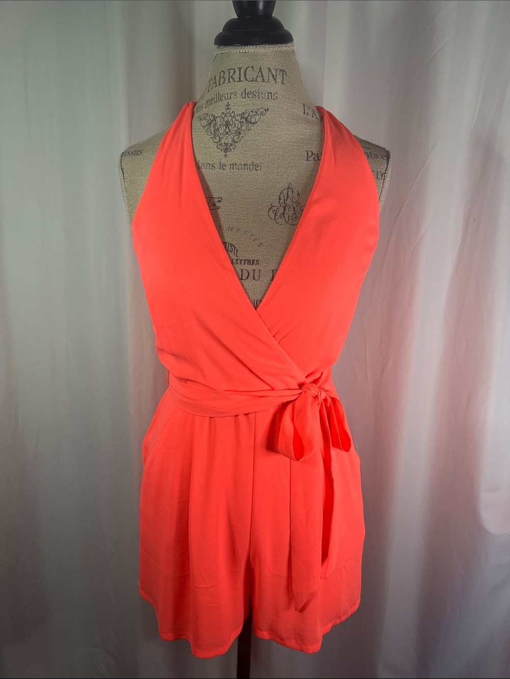 Express Sleeveless Wrap Halter Romper in Bright Coral